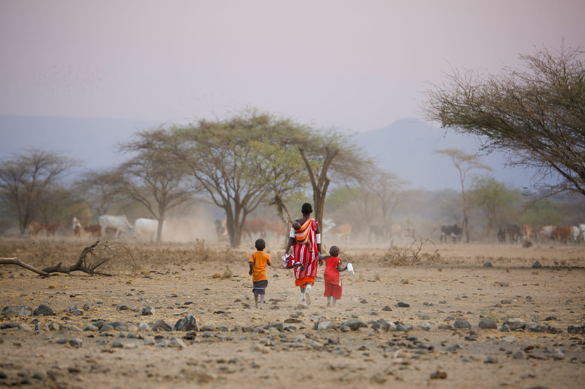 Maasai Mother and Her Children Walking_Mar Gone Wild